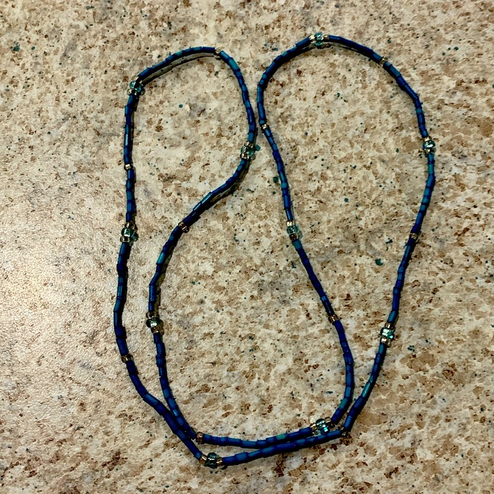 Beaded necklace. Blue and silver tones.